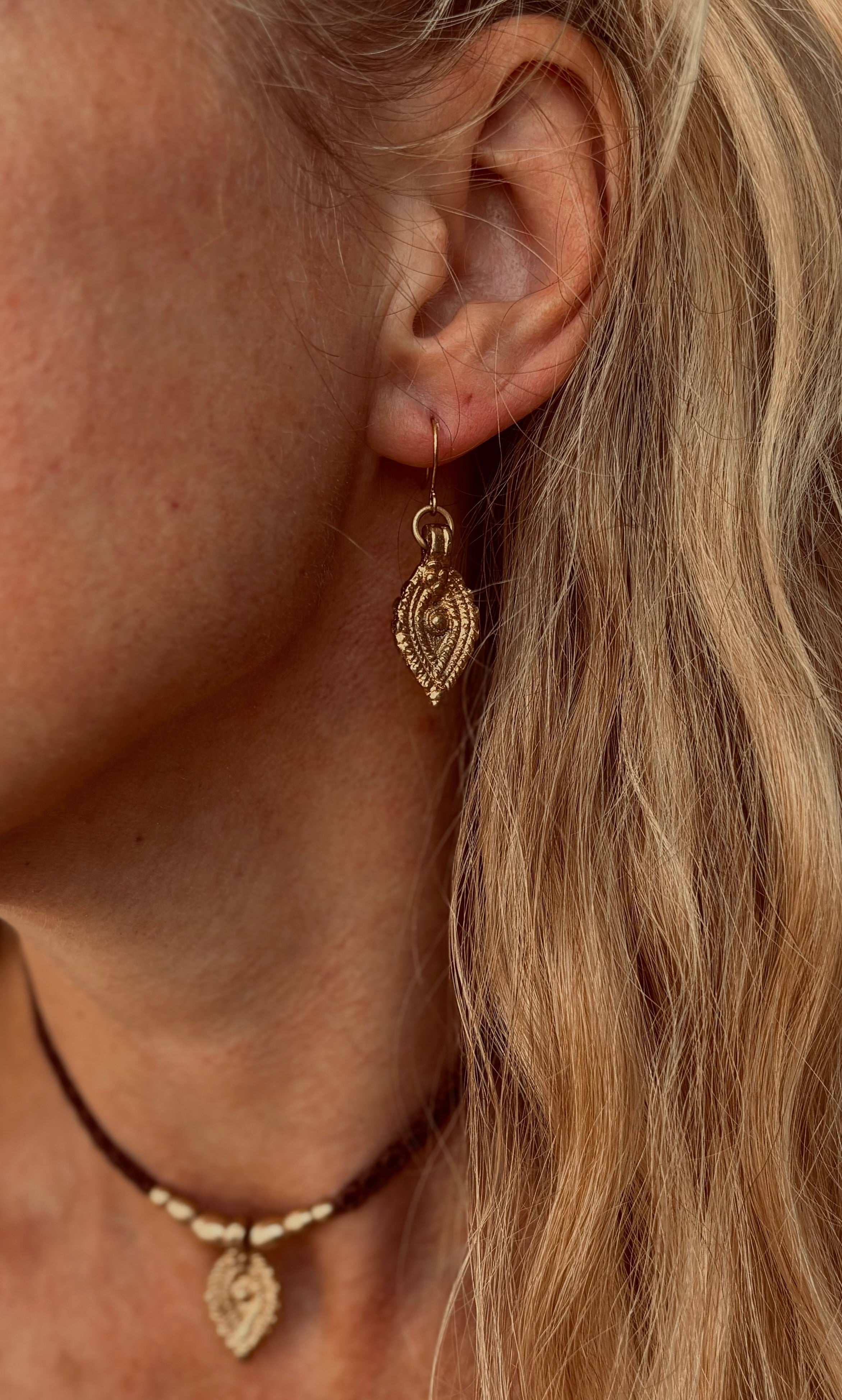 The Oko Kaya charm earrings