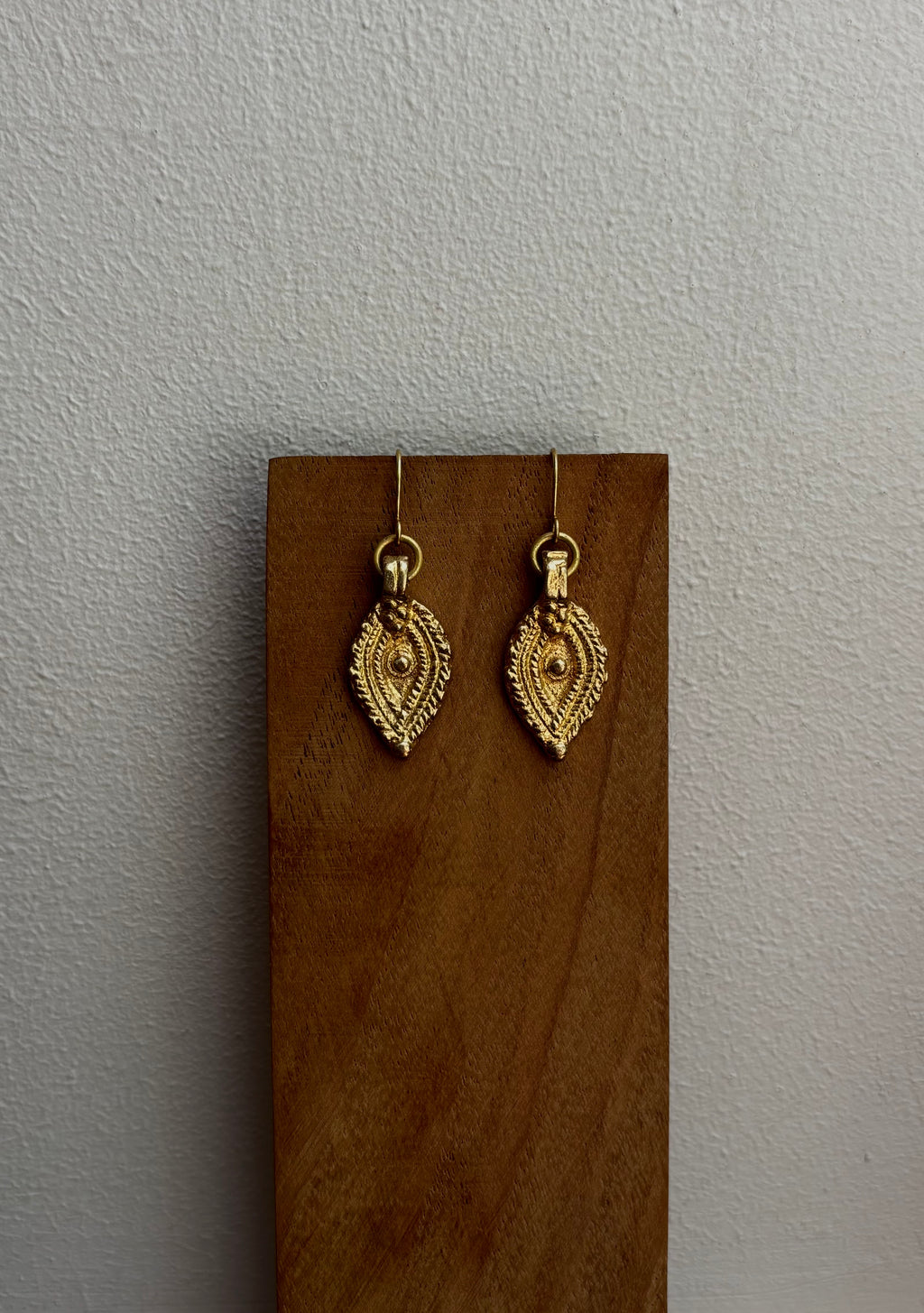The Oko Kaya charm earrings