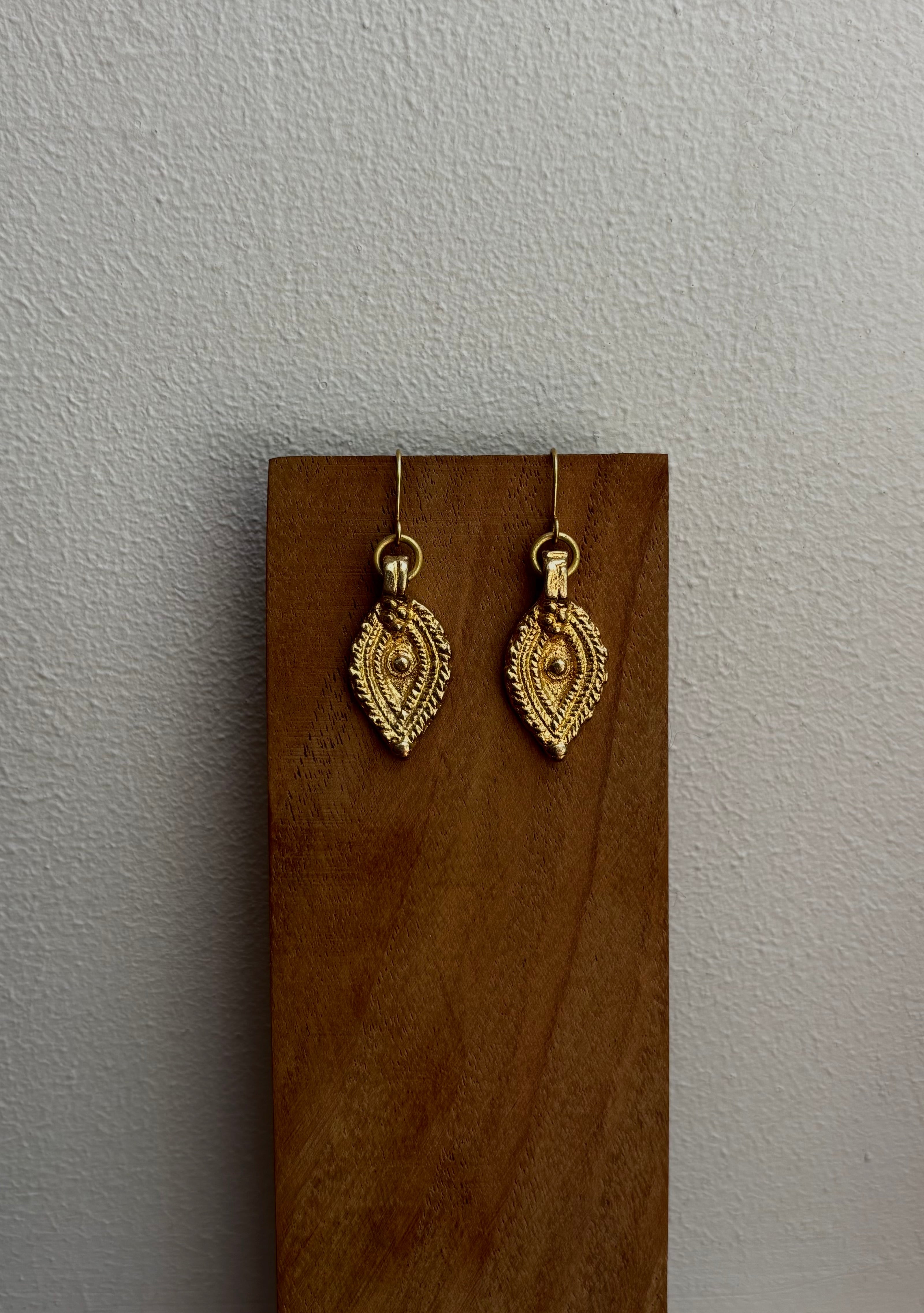 The Oko Kaya charm earrings